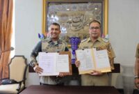 Wali Kota Makassar Moh Ramdhan Pomanto melakukan Penandatanganan Nota Kesepakatan Bersama (MoU) antara Pemkot Makassar dengan PT Bank Mandiri (Persero)